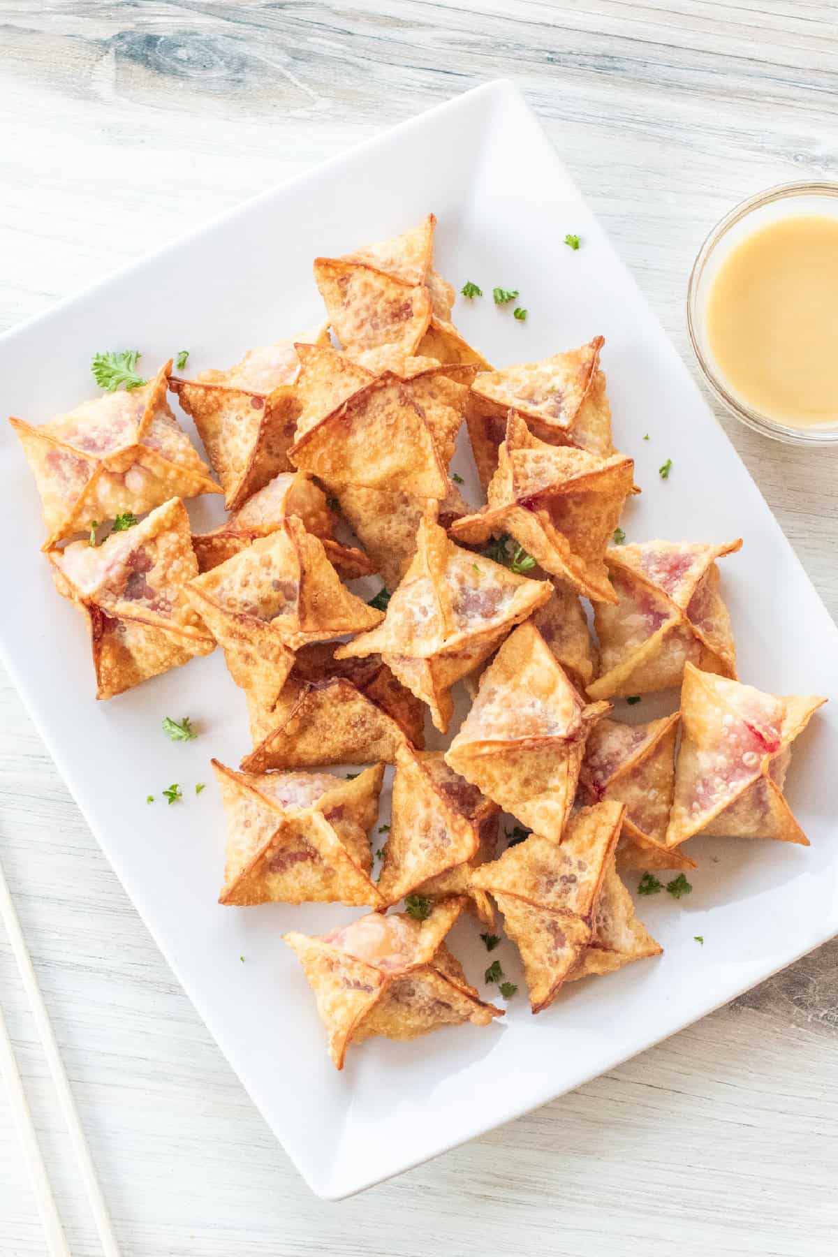a plate of crispy wontons.