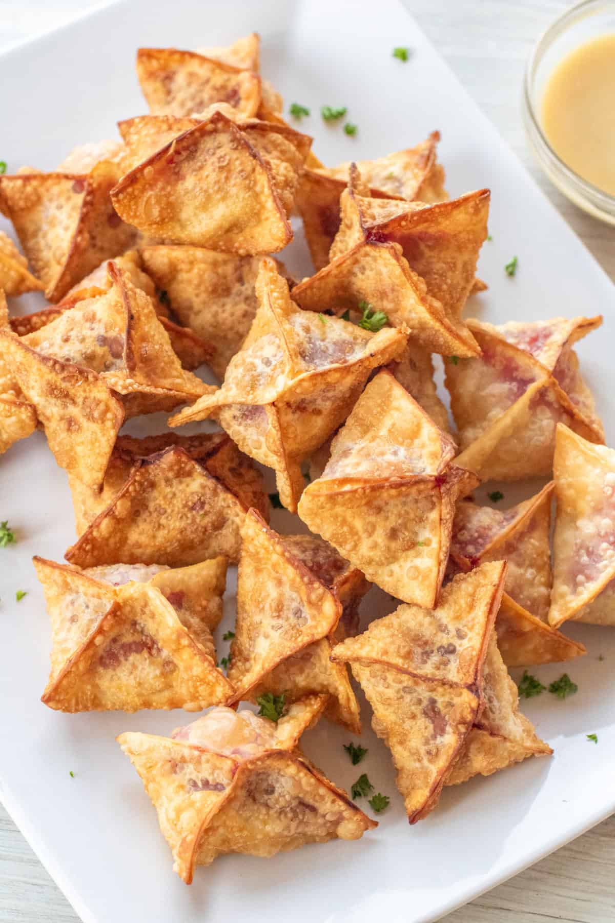 a plate of crispy wontons.