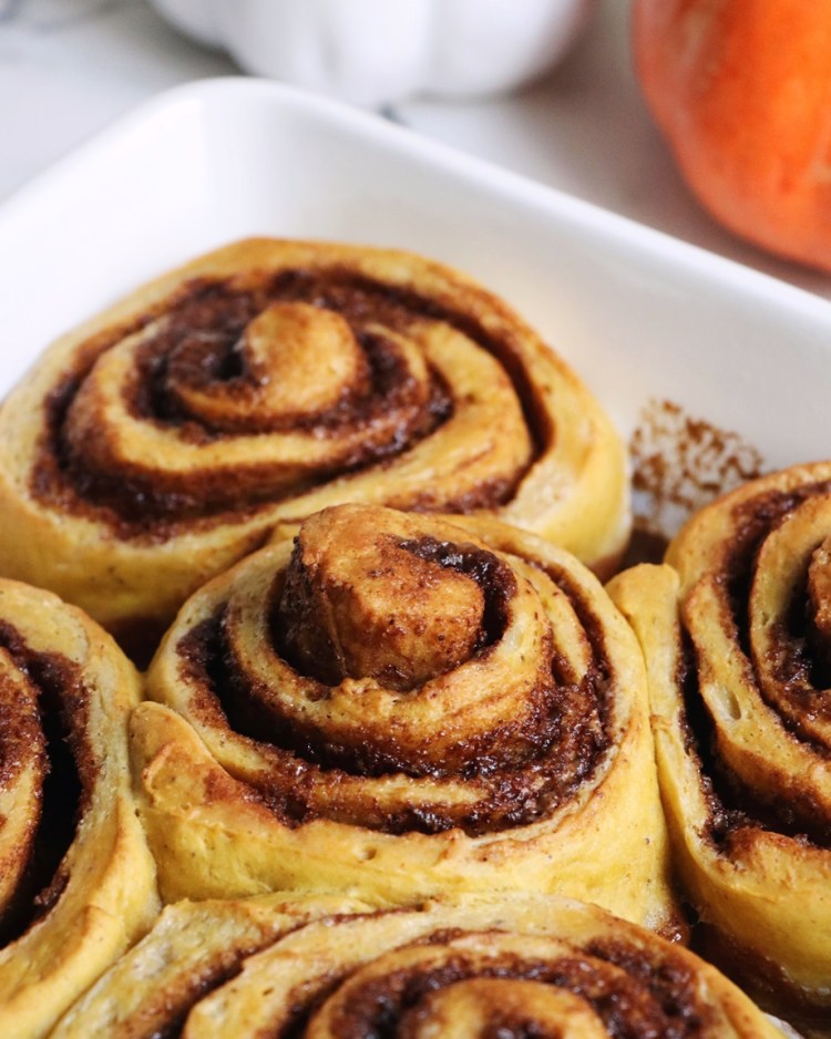 Freshly baked cinnamon rolls with pumpkin