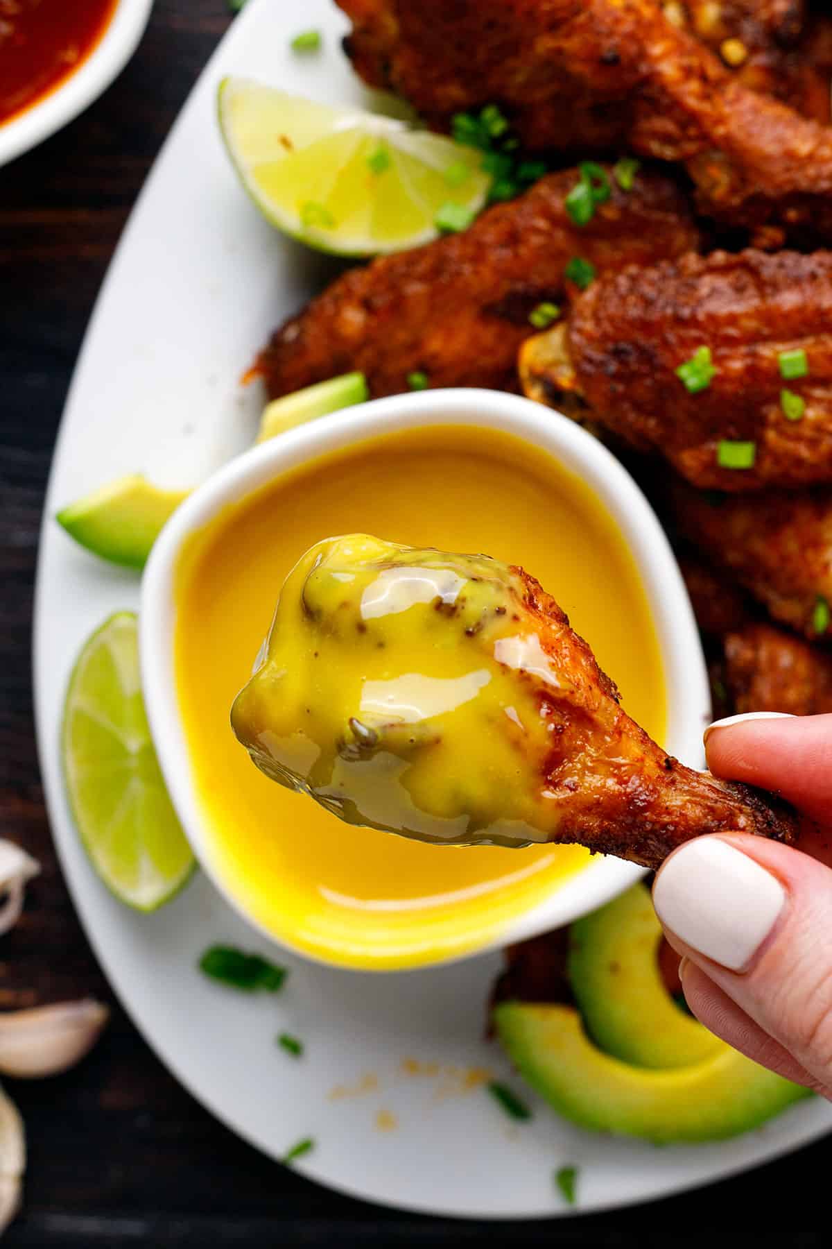 Baked chicken wing dipped in honey-mustard sauce.