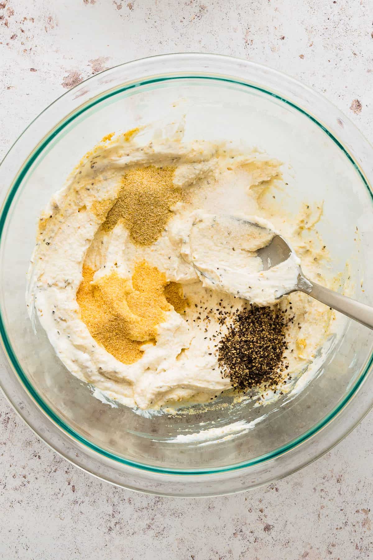 combine the sour cream, salt, pepper, garlic powder, and onion powder in a bowl.