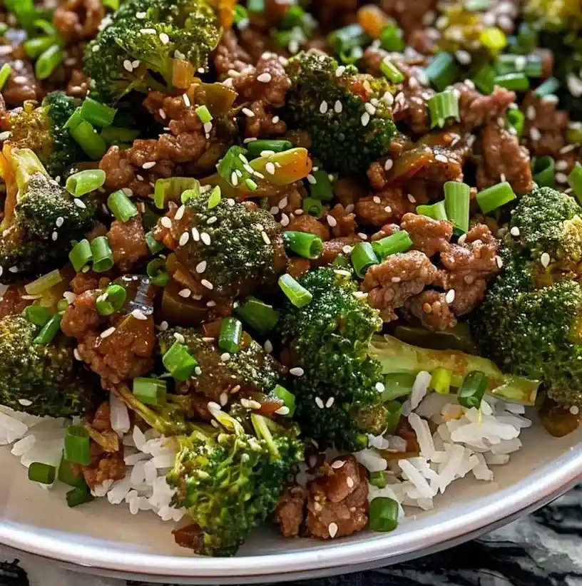 ground beef and broccoli stir fry with rice on a plate
