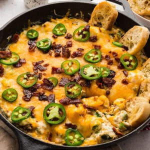 Jalapeno popper dip in a cast iron skillet.