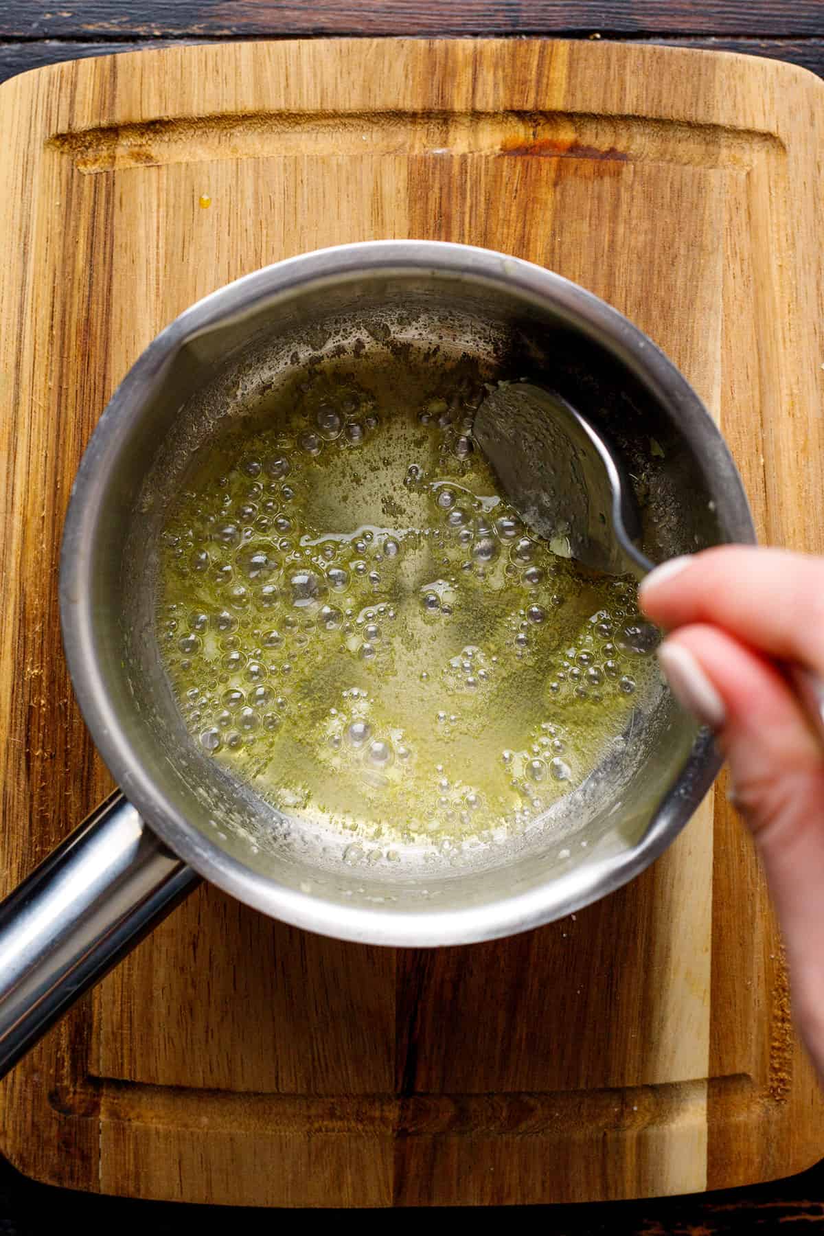 melted butter and minced garlic in a small pot.