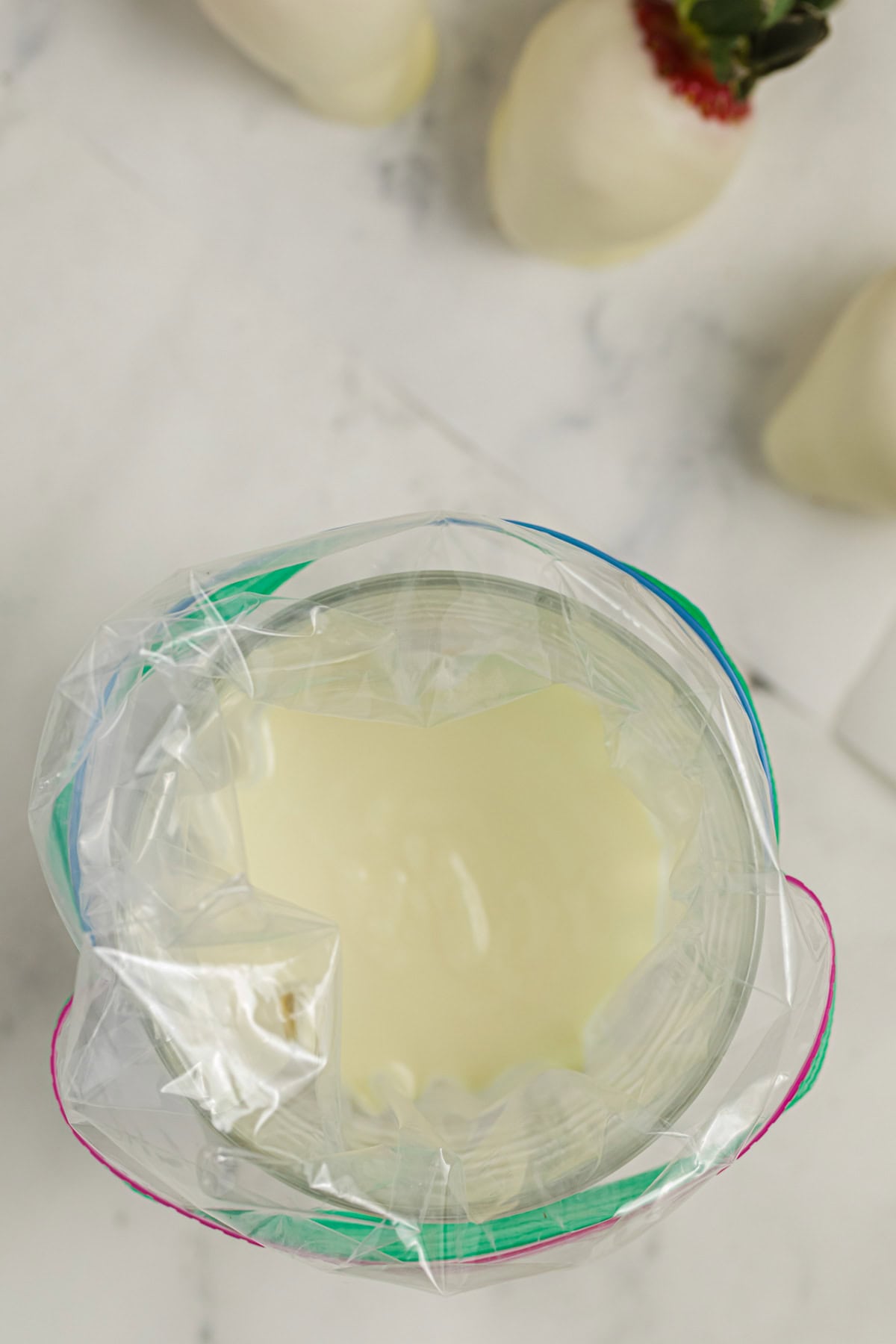 Melted white chocolate in a ziplock bag.