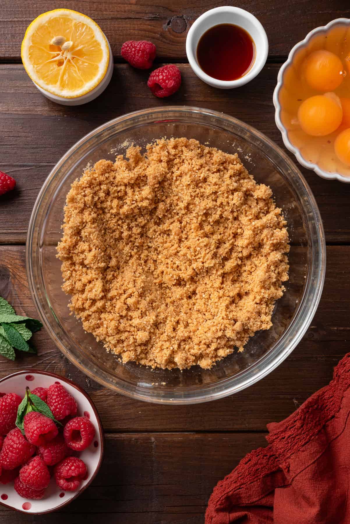 Mixed ground cracker crust ingredients in a bowl.