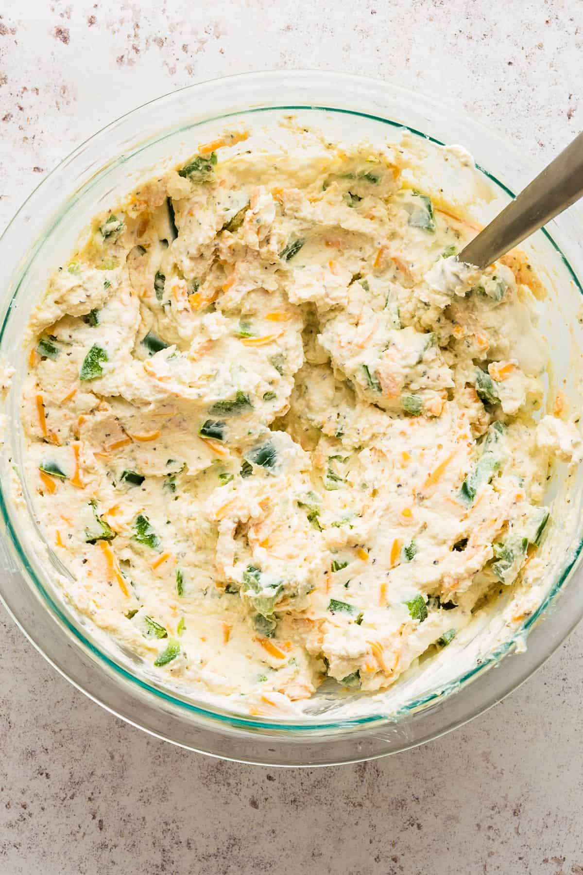 mixed ingredients for jalapeno popper dip in a bowl.