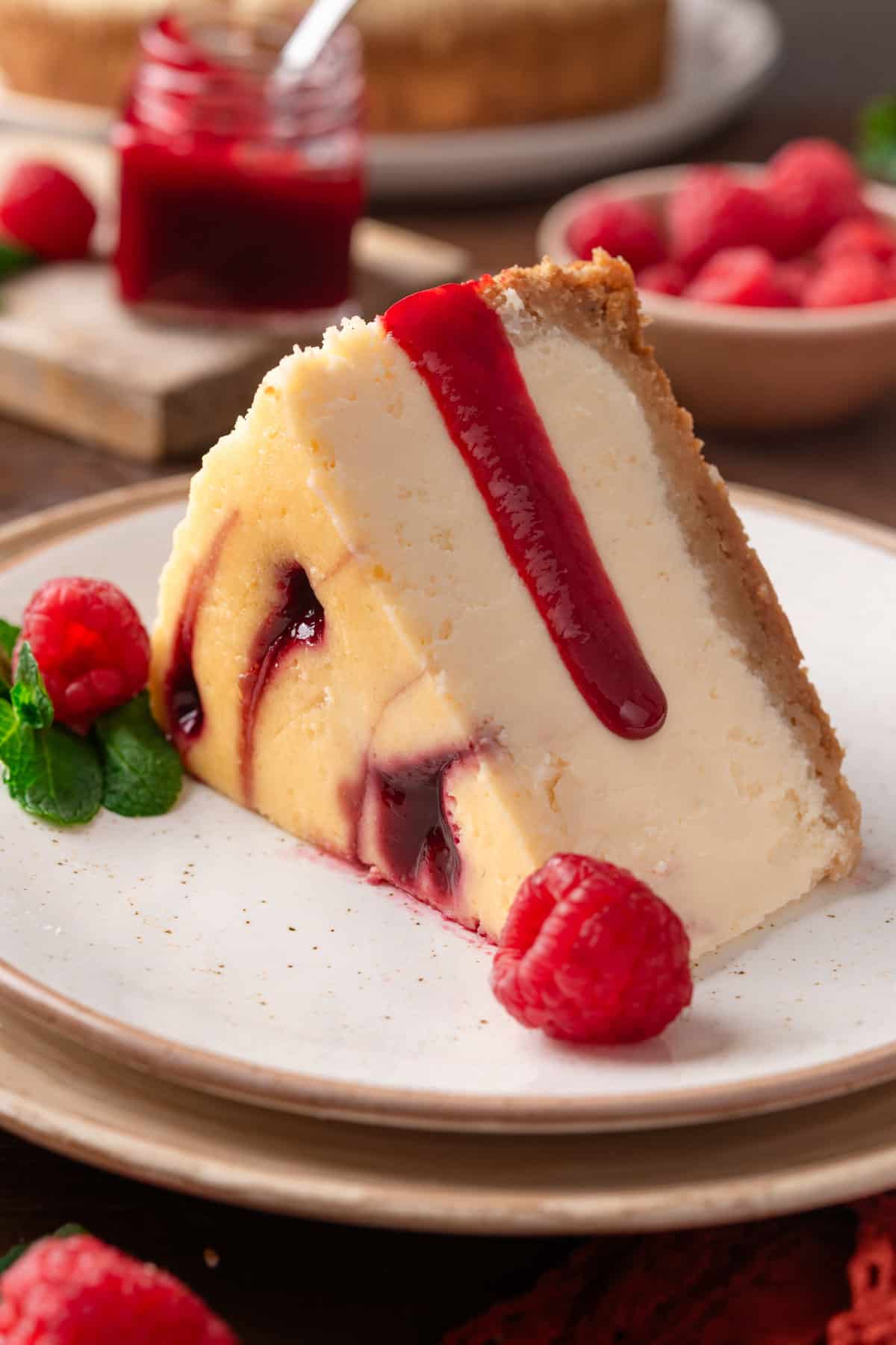a slice of Raspberry cheesecake on a plate.