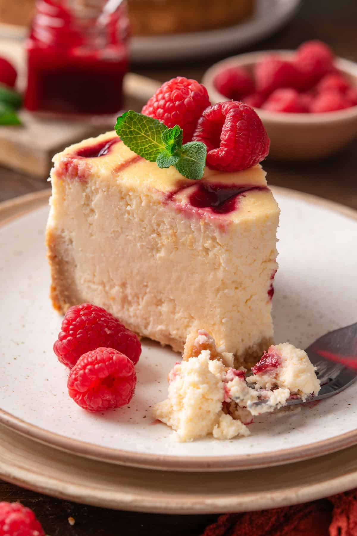 a slice of Raspberry cheesecake - on a plate.