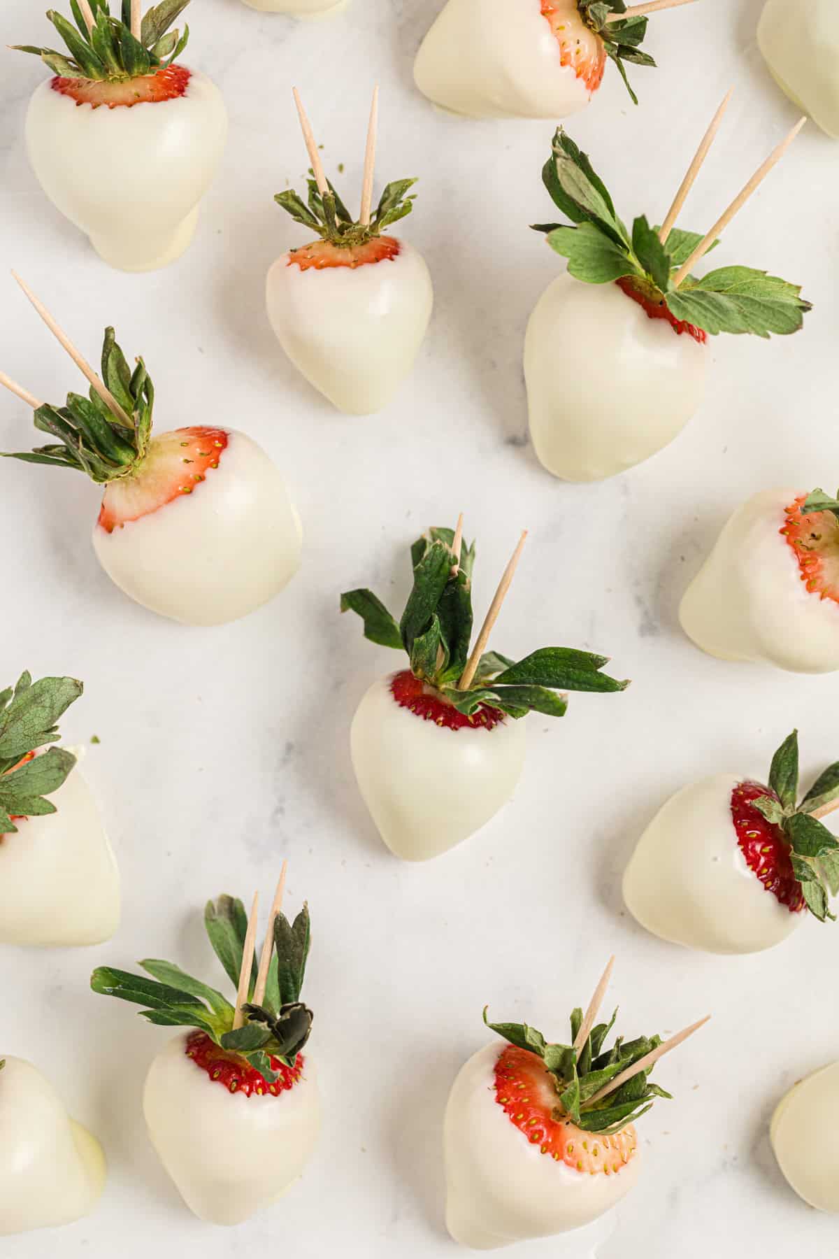 Several strawberries dipped in white chocolate.