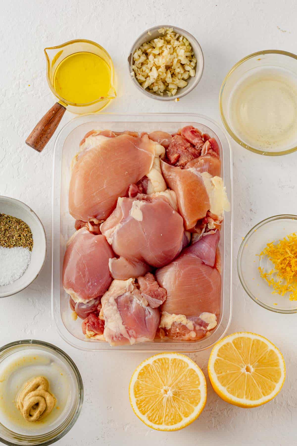 ingredients for sheet pan greek chicken gyros on a counter.
