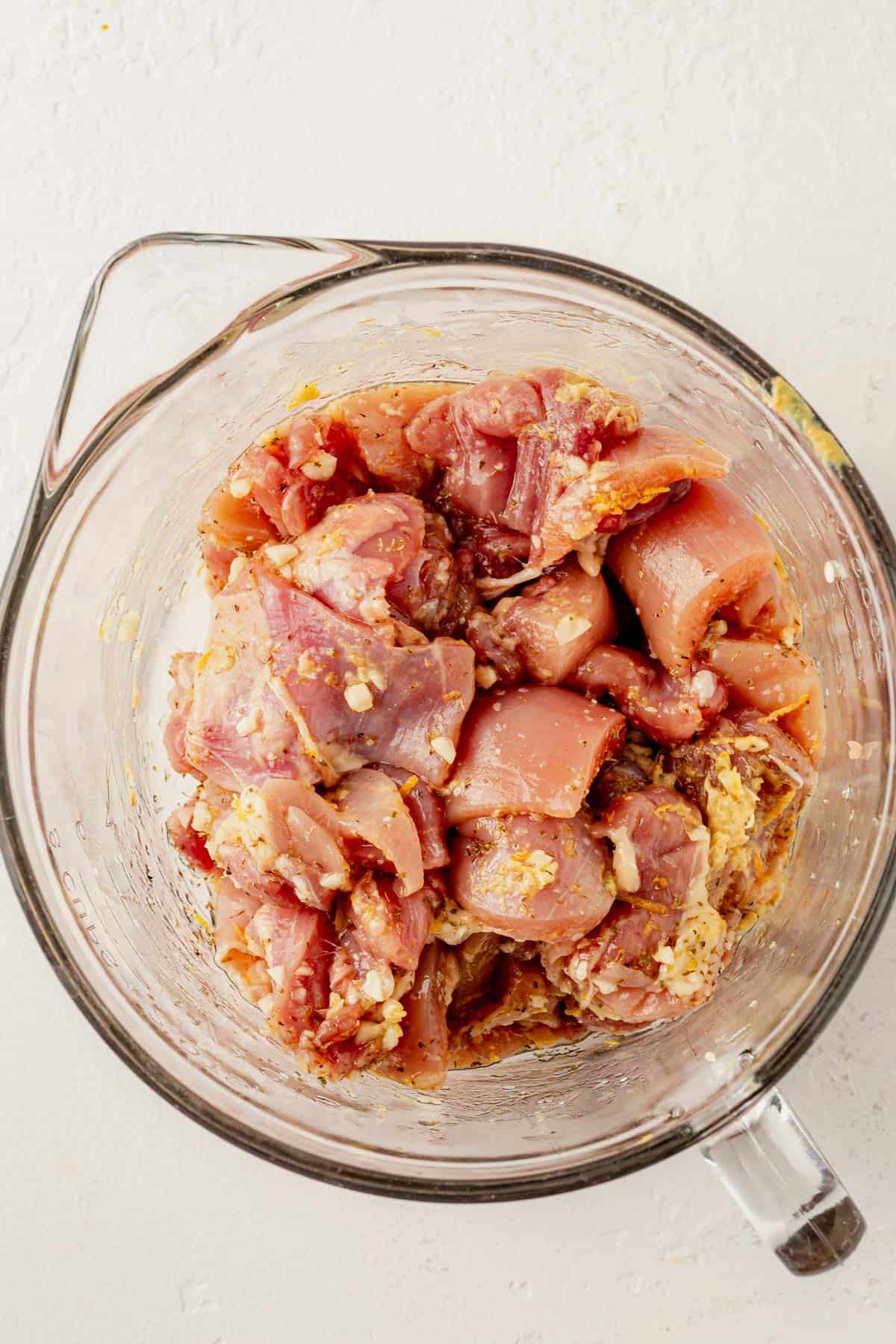 marinated greek chicken in a bowl.