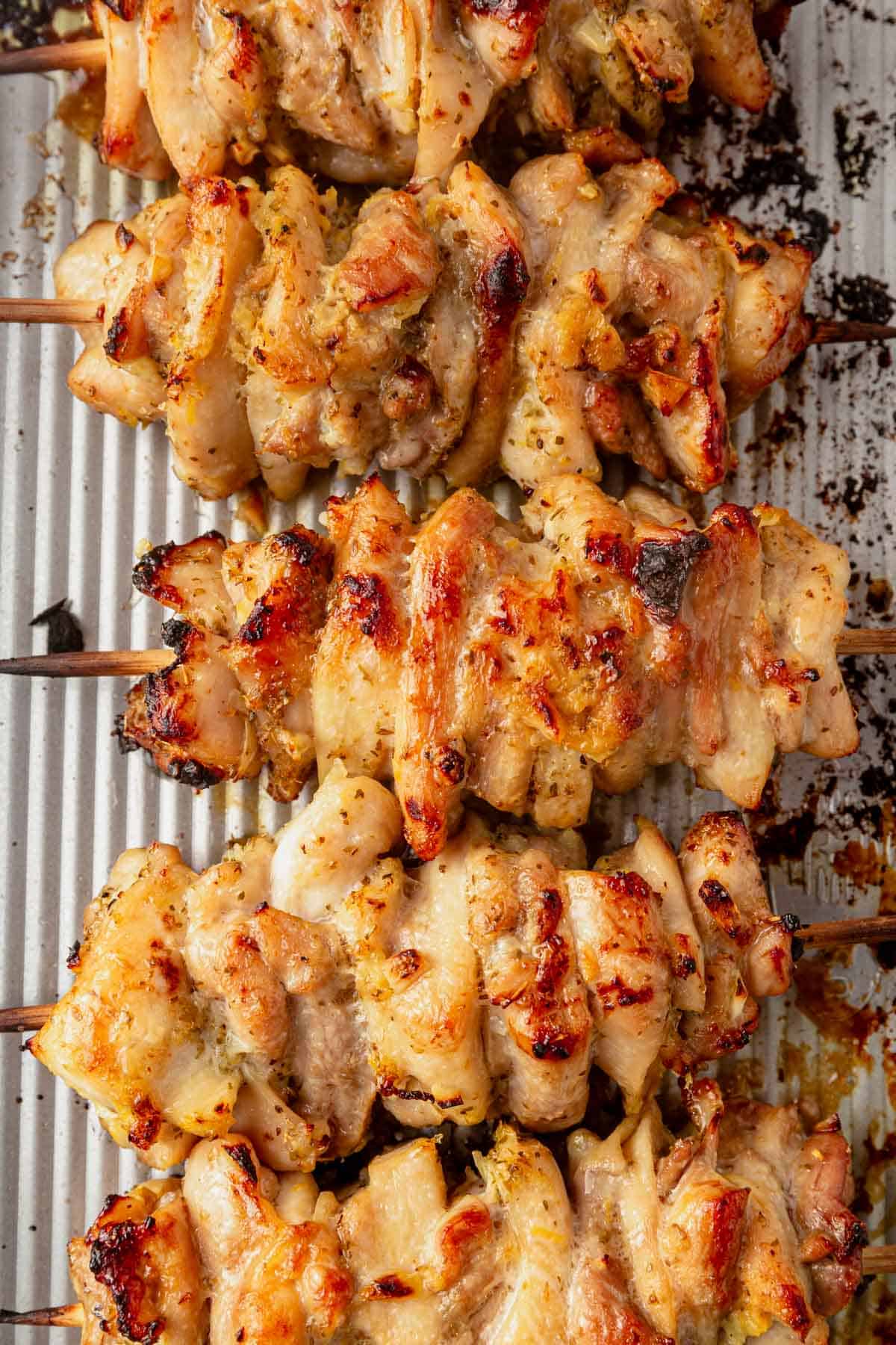 chicken gyro skewers on a sheet pan.