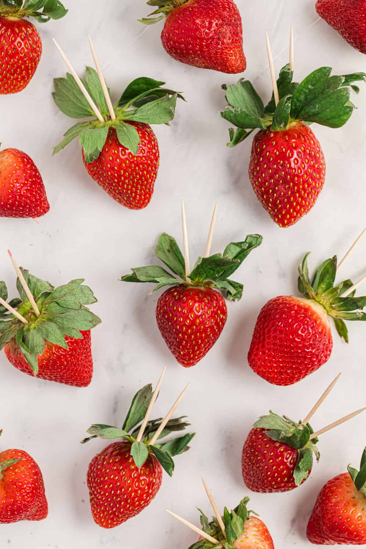 strawberries with inserted toothpicks.