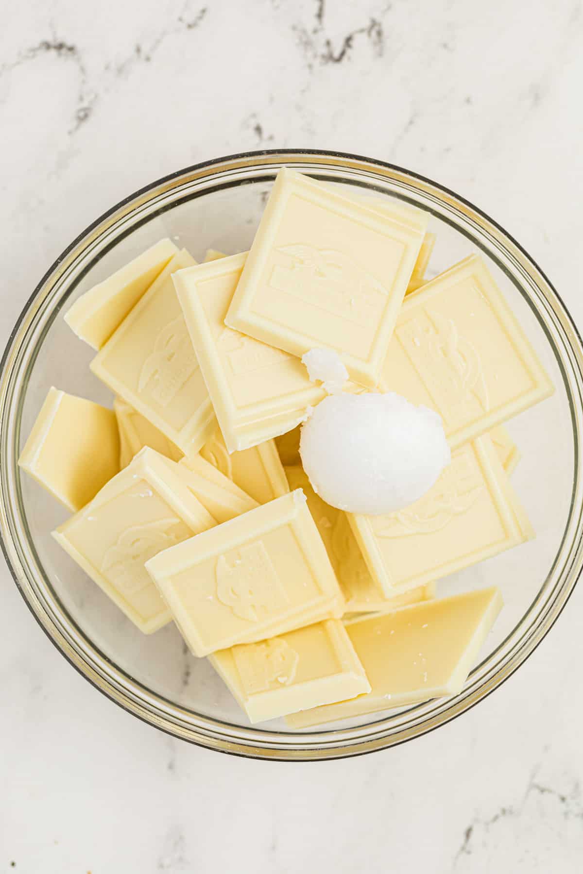 White chocolate with coconut oil in a mixing bowl.