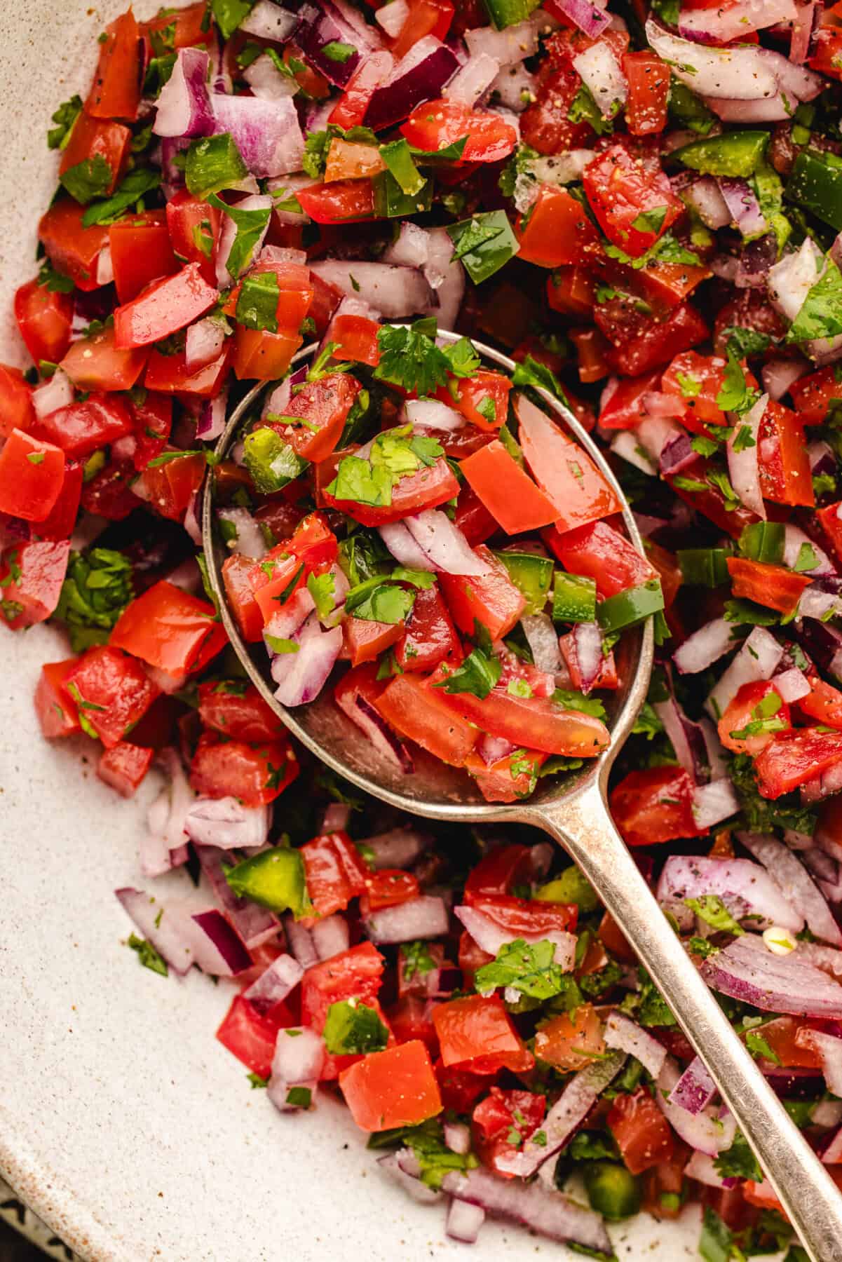 Pico De Gallo Pico De Gallo with a spoon (close-up).