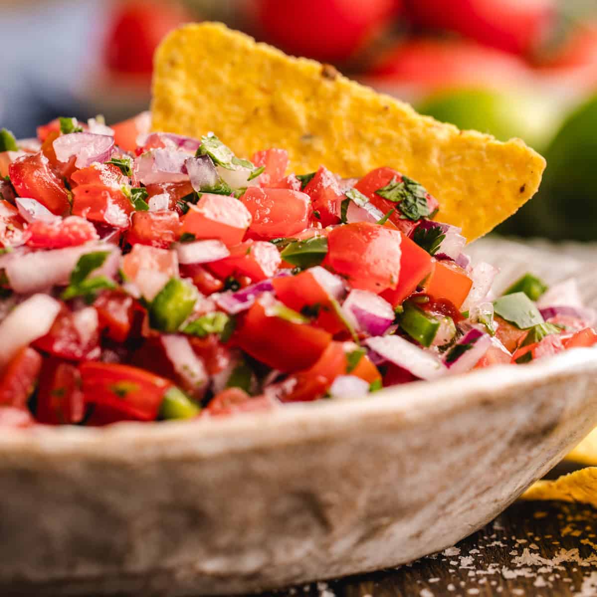 Pico De Gallo Pico De Gallo with tortilla chips - in a bowl.