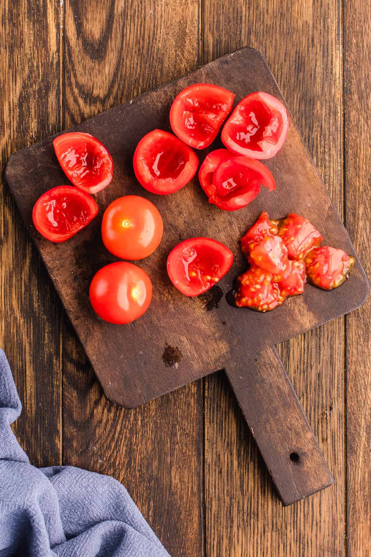 How to Make Pico De Gallo Cutting tomatoes on a cutting board.