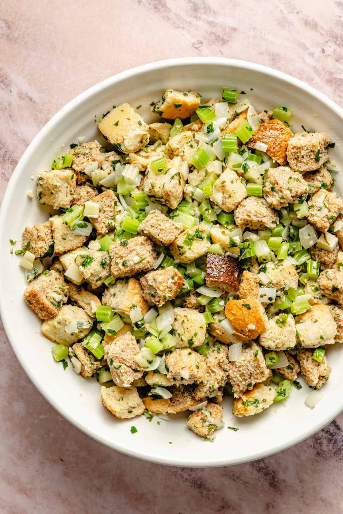 unbaked stuffing mixed in a bowl.