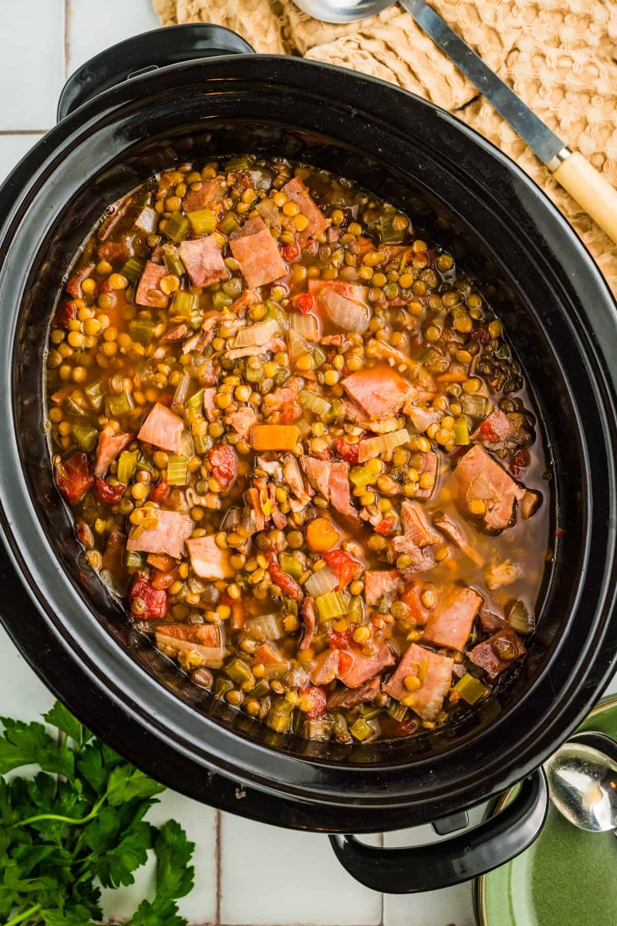 Slow Cooker Ham and Lentil Soup Ham and Lentil Soup in a black slow cooker.
