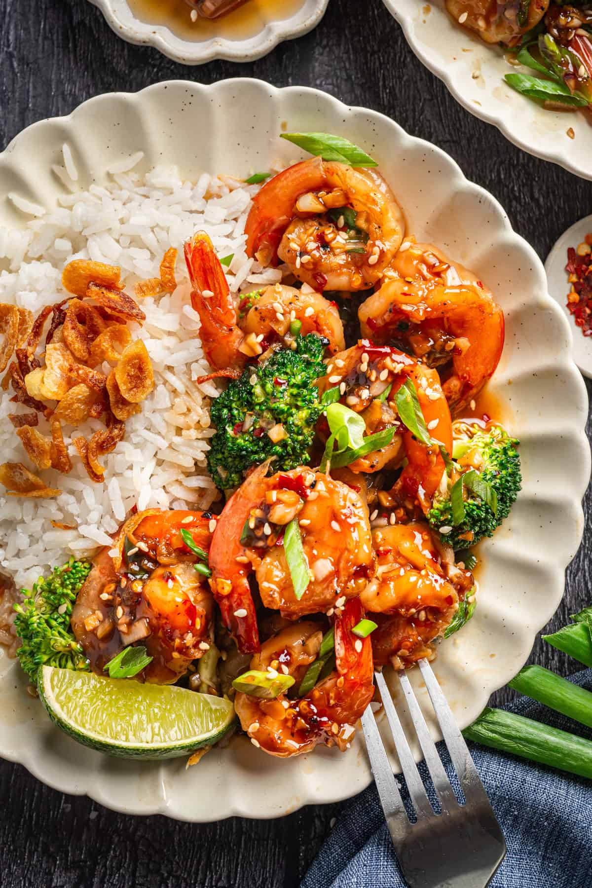 Honey Garlic Shrimp with Broccoli and Coconut Rice - on a white plate.