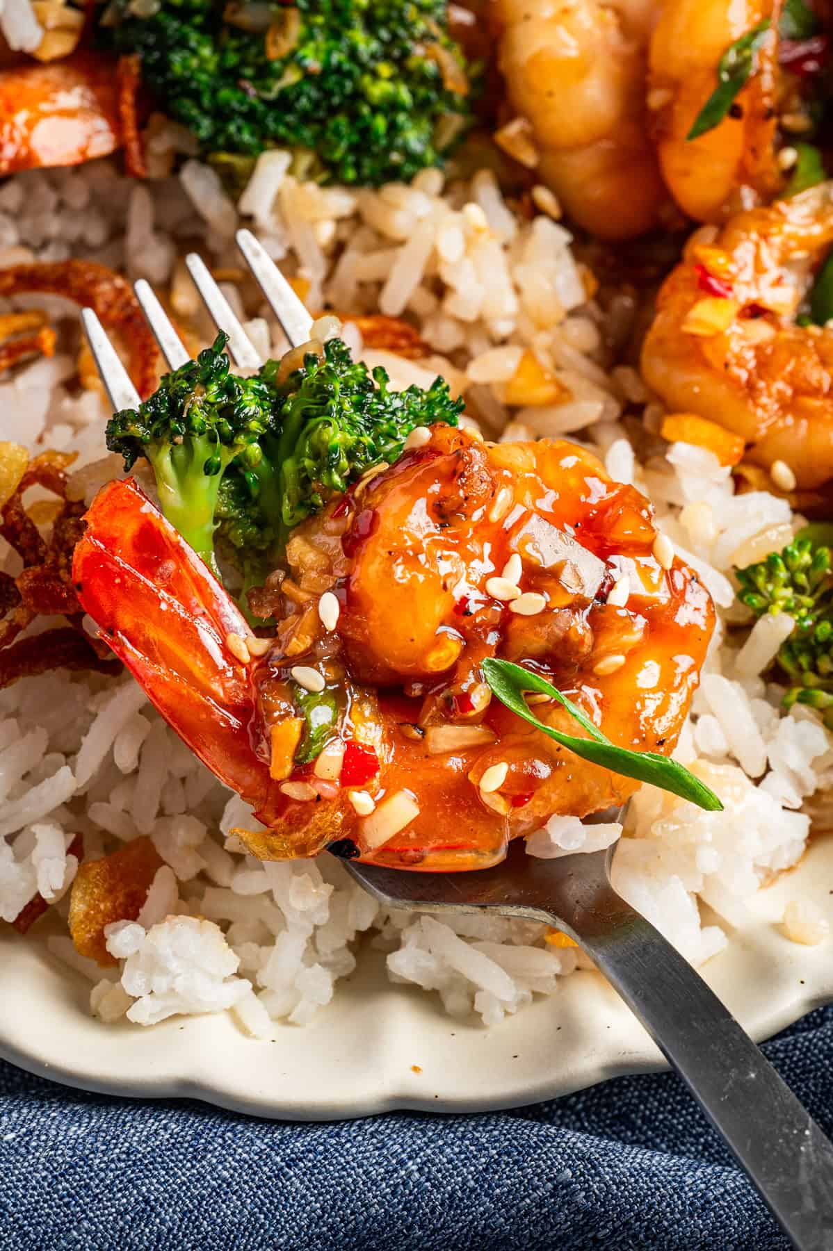 Honey Garlic Shrimp (on a fork) with Broccoli and Coconut Rice.