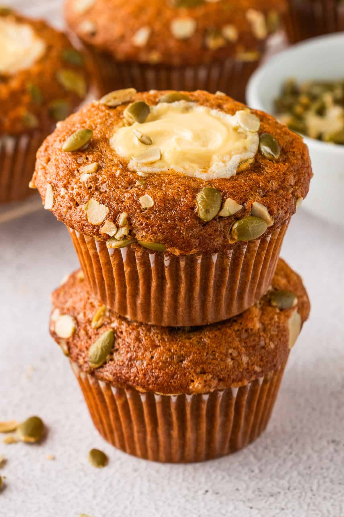Pumpkin Cream Cheese Muffins (one on top of the other).