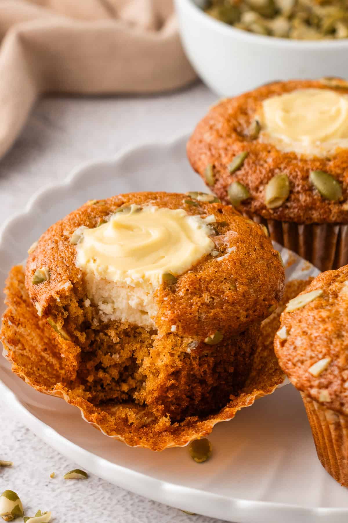 Pumpkin Cream Cheese Muffin - with a small bite out.