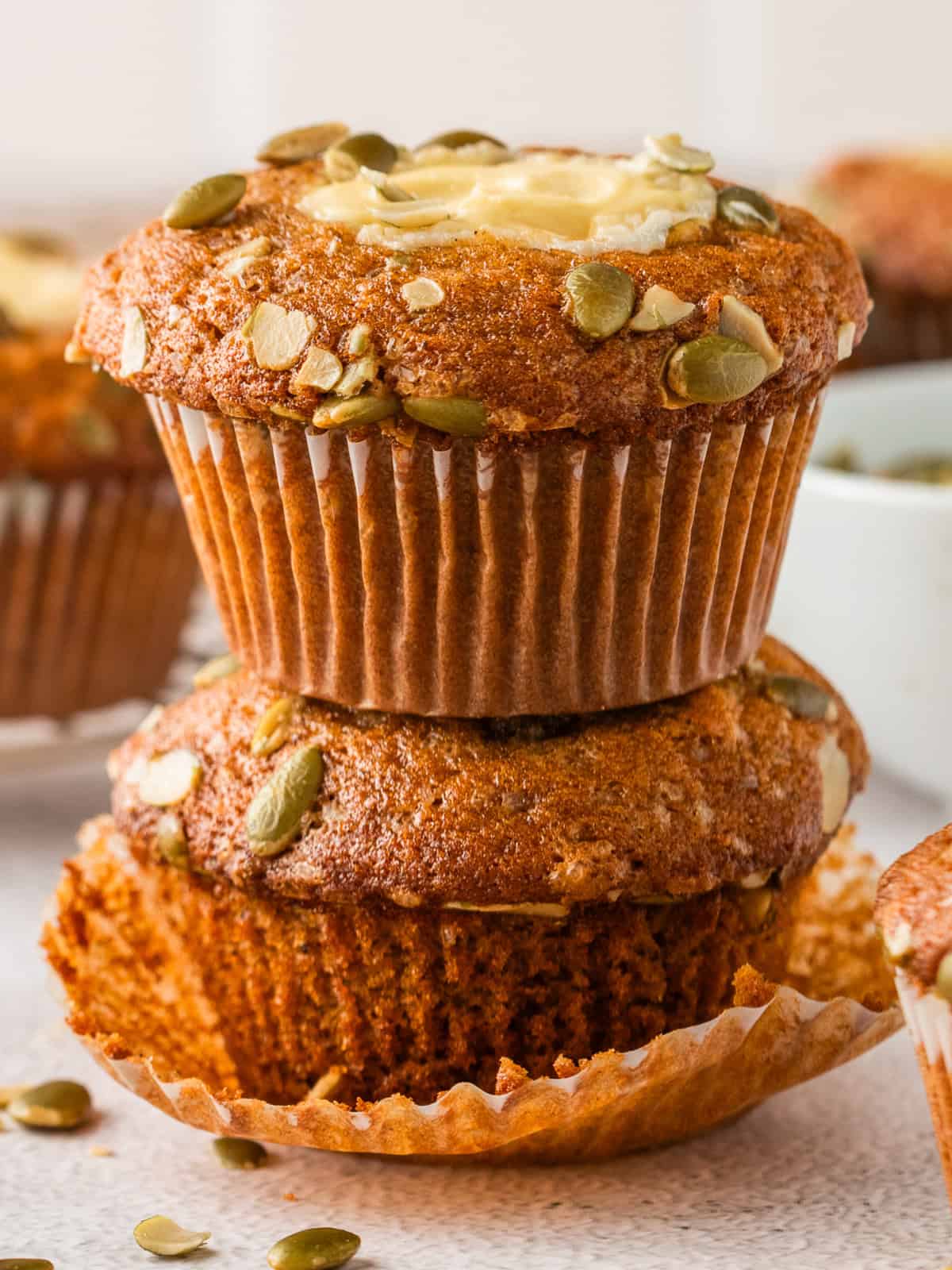 Pumpkin Cream Cheese Muffins (one on top of the other).
