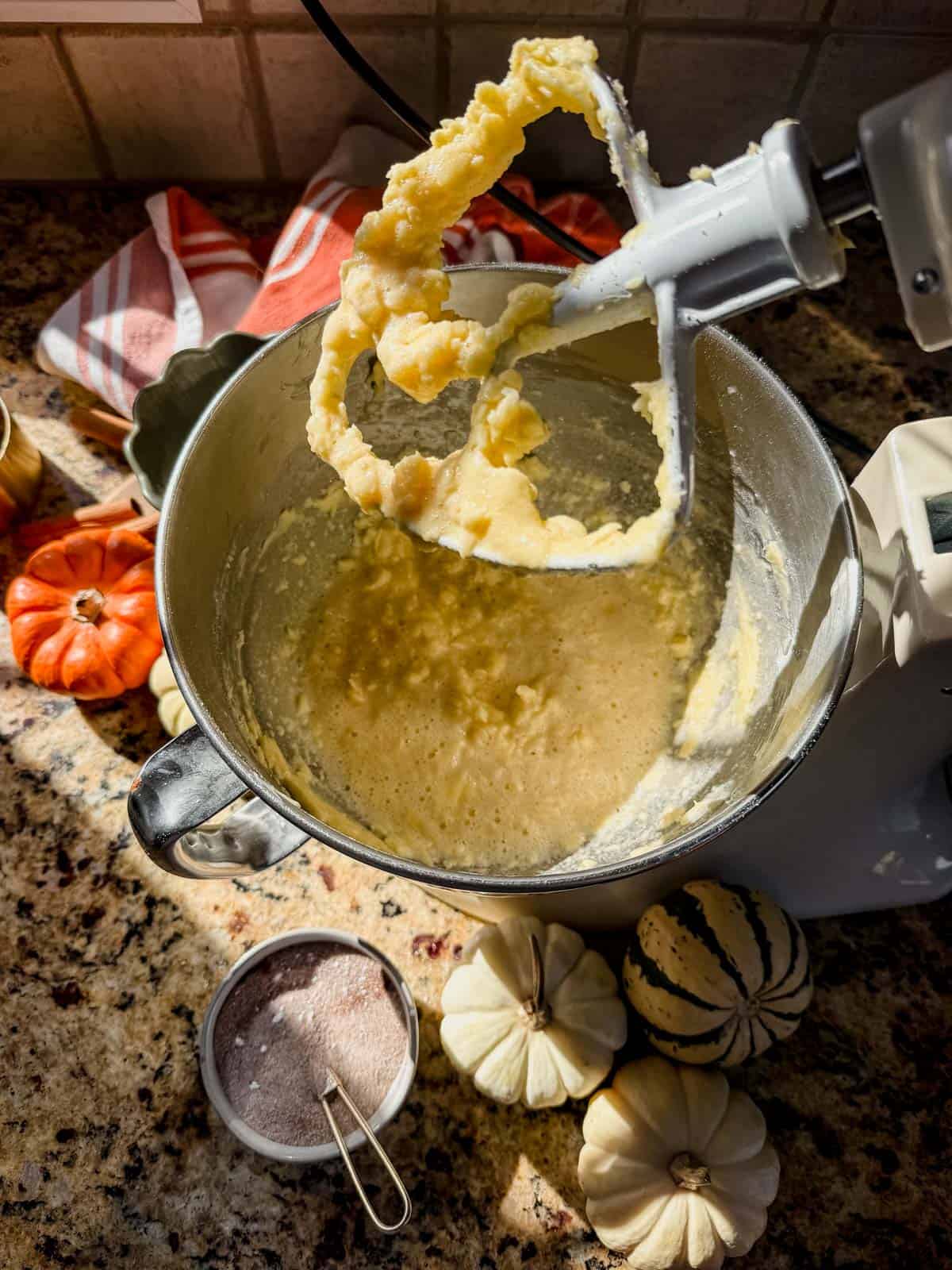 wet ingredients for pumpkin pie cookies in a stand mixer.